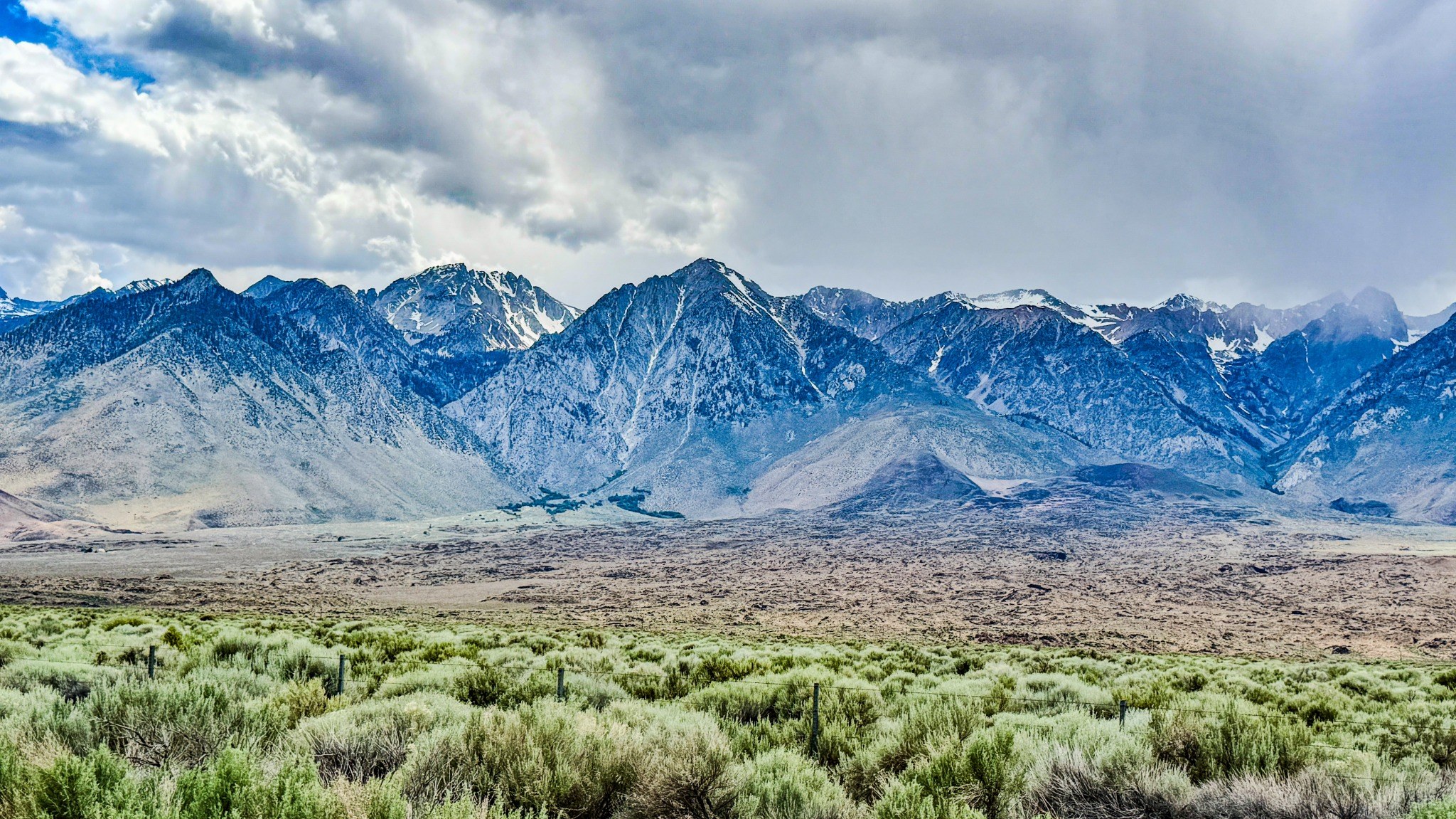 Mountain range beneath dramatic clouds